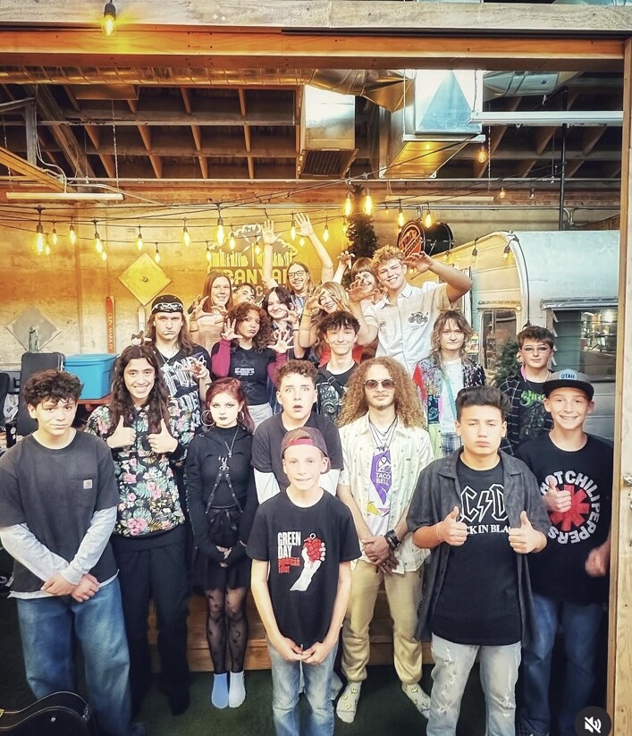 Imagine Music Rock Academy students together after performing